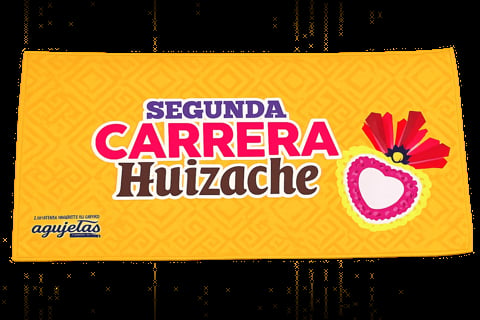 Yellow sign for Segunda Carrera Huizache with colorful pink and red heart-shaped flower design and Agujelao logo